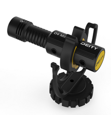 Black compact microphone with yellow accents and shock mount base
