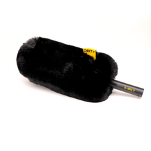 Black fuzzy microphone windscreen with yellow DEITY label