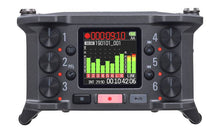 Zoom F6 field recorder front panel with six channel controls and colour display