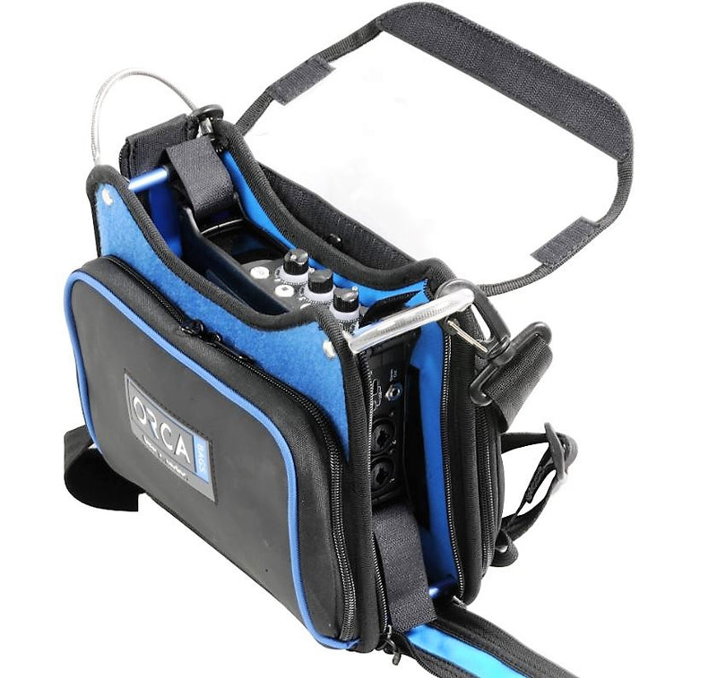 Orca XS audio bag with blue fabric, padded handle, zipper pockets, and front logo patch