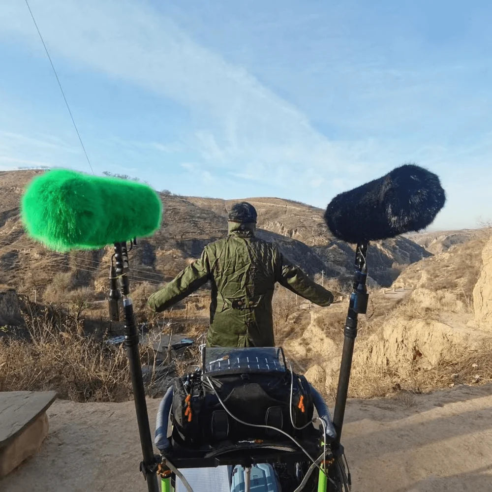 Fur wind jacket, green and black faux-fur wind covers on boom microphones