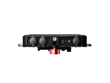 Roaming hub base rear view with ports, knobs, and red mounting cap