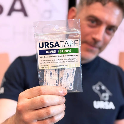 URSATAPE Invisi Strips pack held in hand, clear pouch with adhesive strips