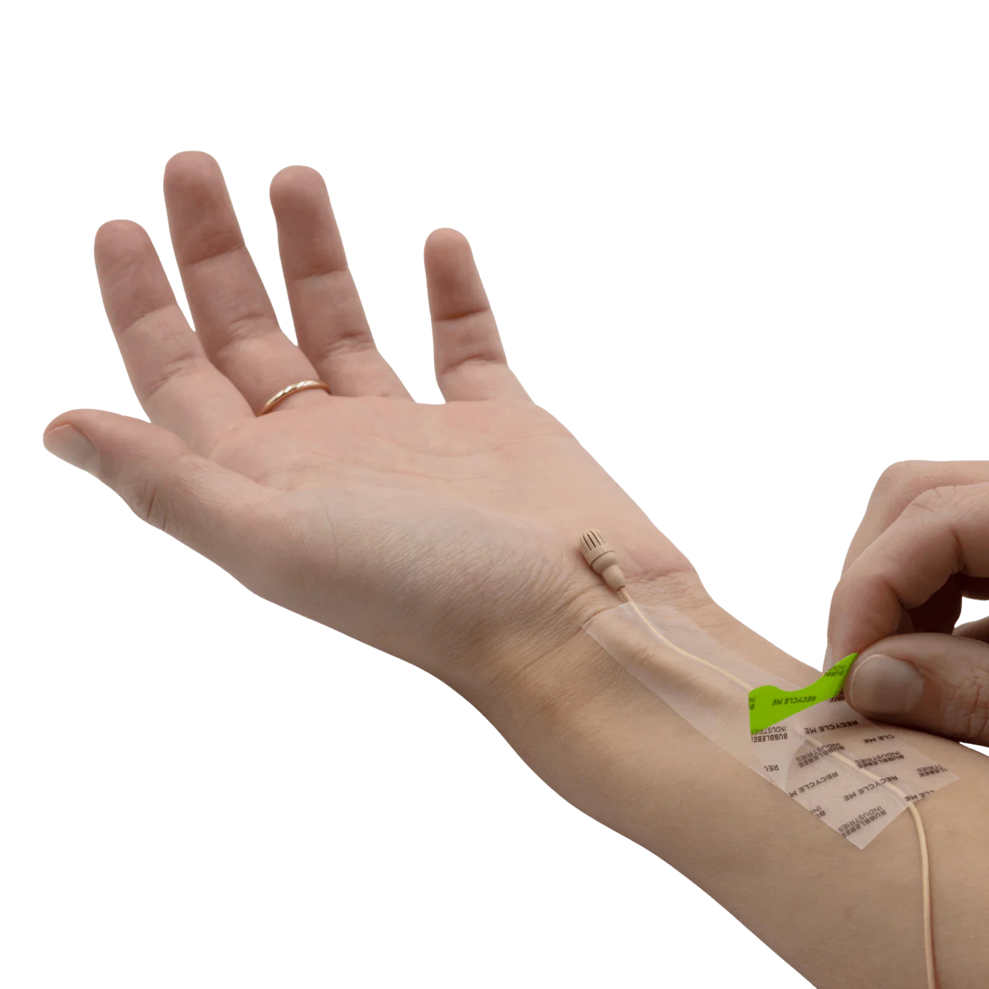 Invisible skin tape being applied on arm with backing sheet