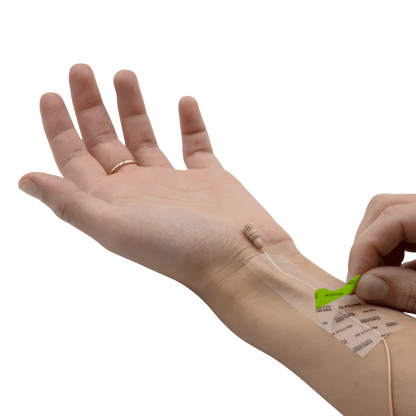 Invisible skin tape being applied on arm with backing sheet