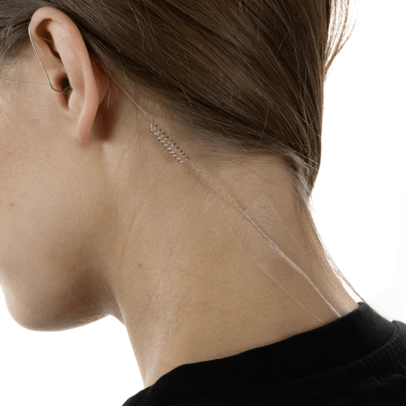 Invisible skin tape on neck area, small clear strips with dotted adhesive