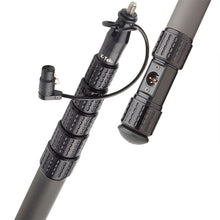 Graphite boom pole with attached cable, two grip sleeves, and connector module