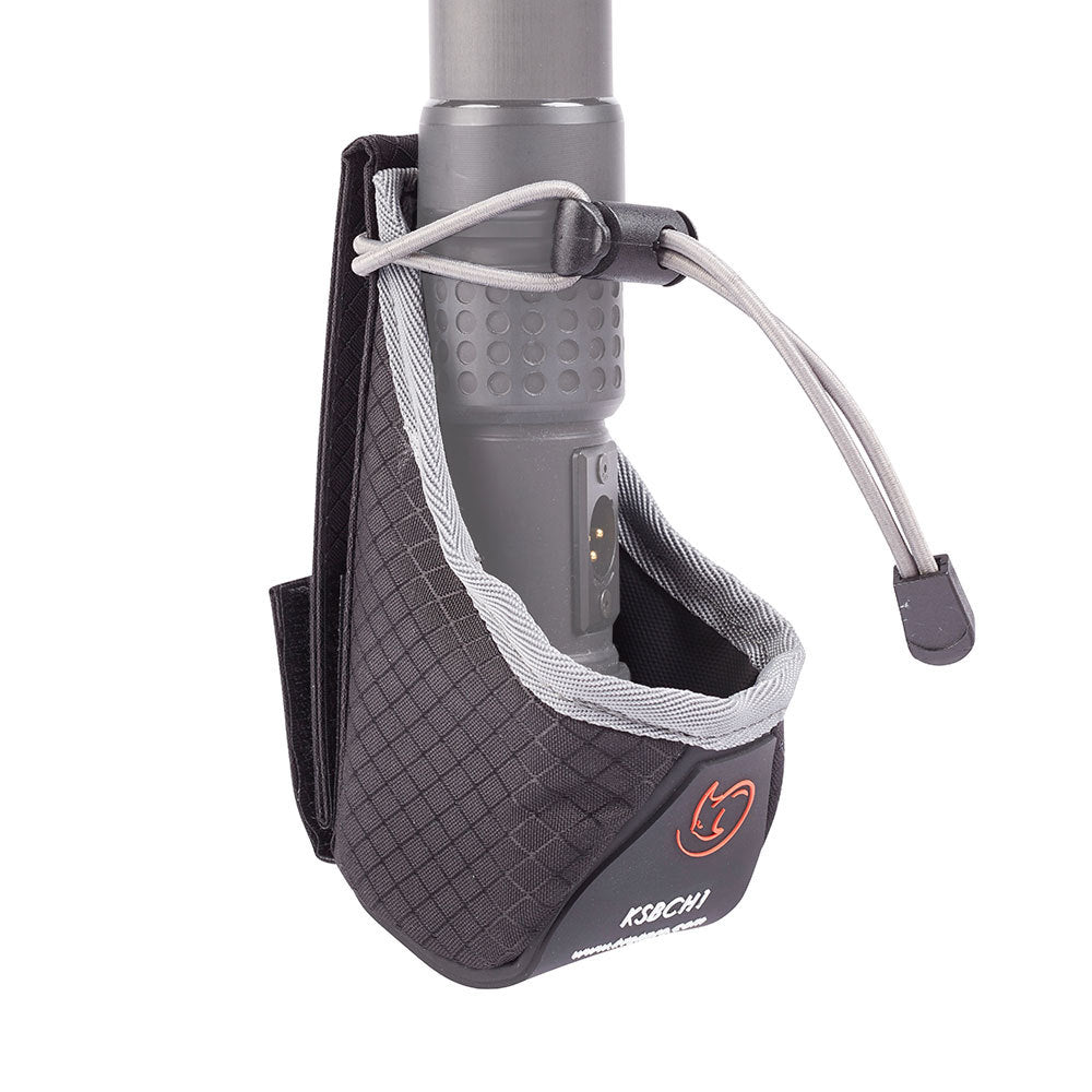 Dark gray cup holder pouch with elastic cord securing a metal cup