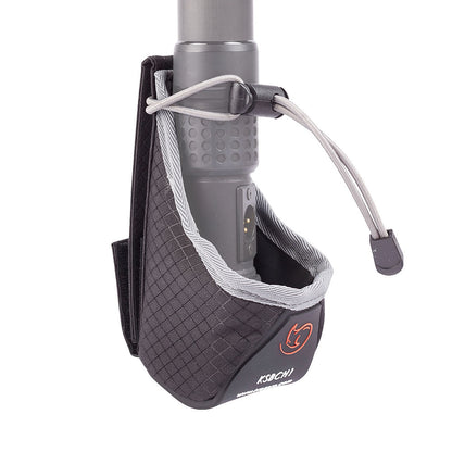 Dark gray cup holder pouch with elastic cord securing a metal cup