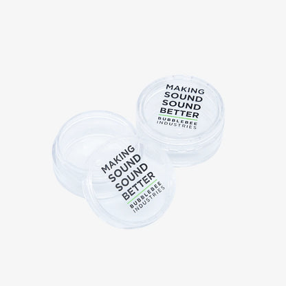 Lav accessory tubs, two clear round tubs with 'Making Sound Better' labels