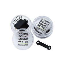 Lav accessory tubs, two clear round tubs with 'Making Sound Better' labels and black parts