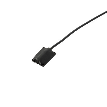 Black lav mic concealer with attached cable and small mesh grille