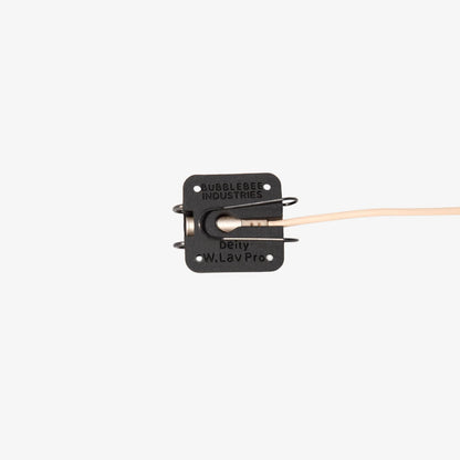 Black lav microphone concealer with label plate, metal clips, and tan cable