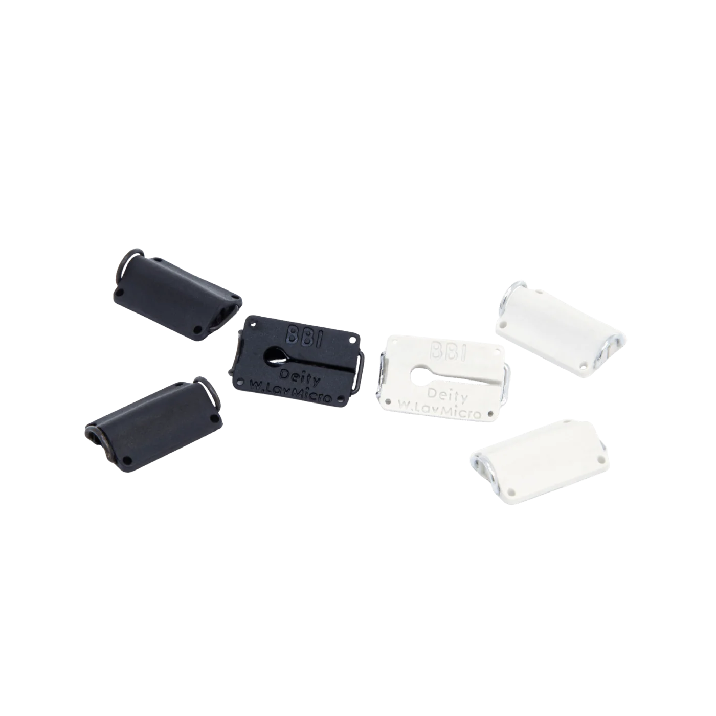 Assorted black and white lav microphone concealer clips with rectangular faceplates