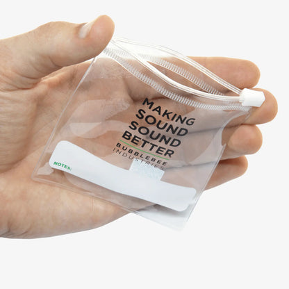 Clear lav mic pouch with zip top and coiled cable, held in hand.