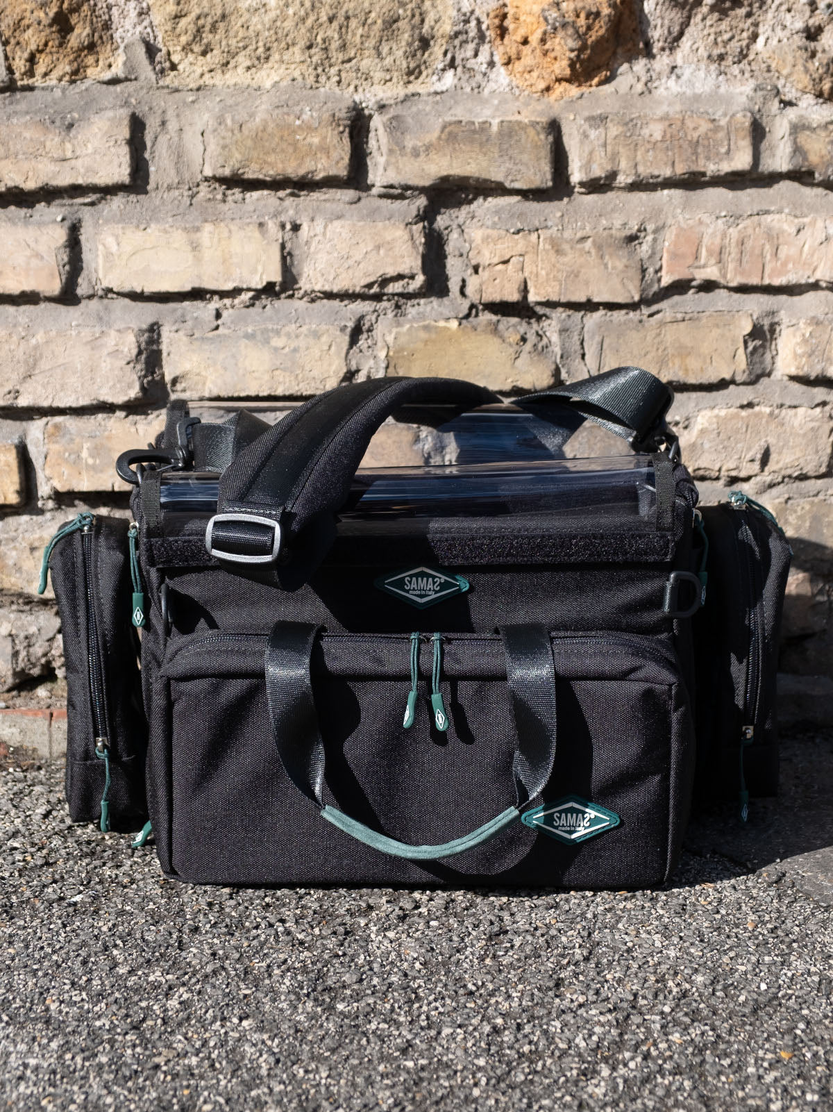 Black medium audio mixer recorder case with front pockets, top handle, shoulder strap