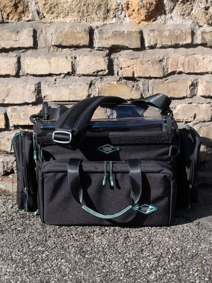 Black medium audio mixer recorder case with front pockets, top handle, shoulder strap