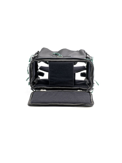 Small audio mixer bag with open top showing dark interior padding and insert pockets