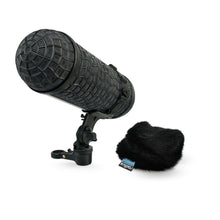 Black handheld microphone with foam windscreen, shock mount, and clip stand