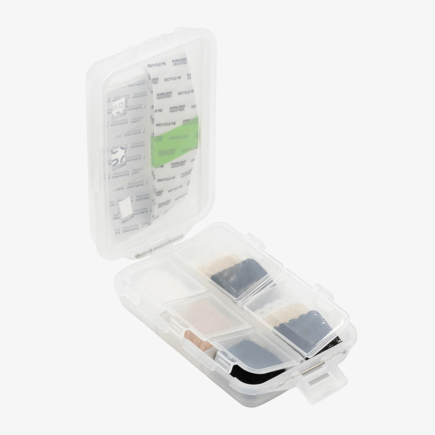 Clear storage case holding several mic foam pads and adhesive strips