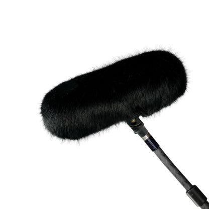 Black furry windscreen cover for handheld microphone on black cable