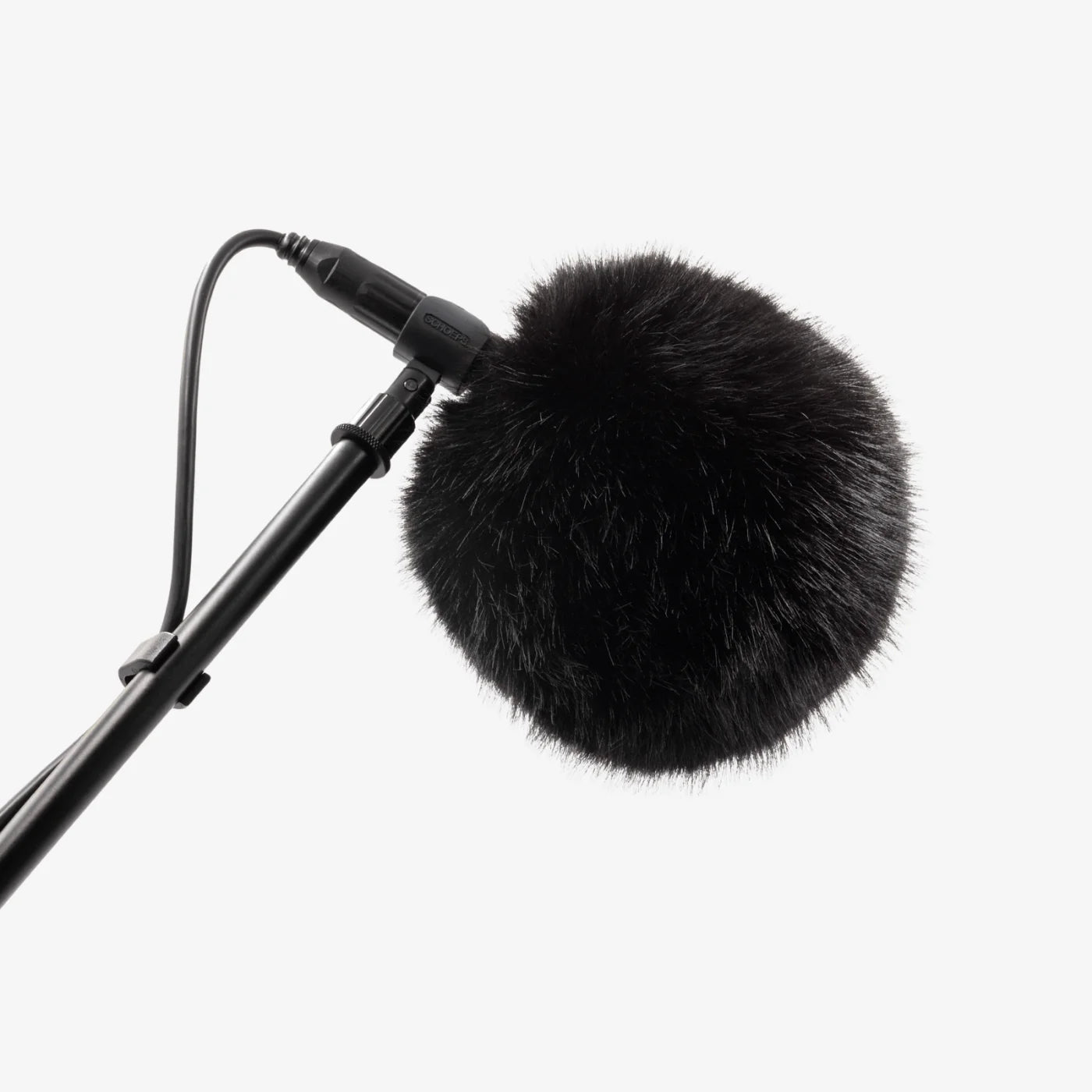 Black fuzzy microphone windscreen ball mounted on a microphone