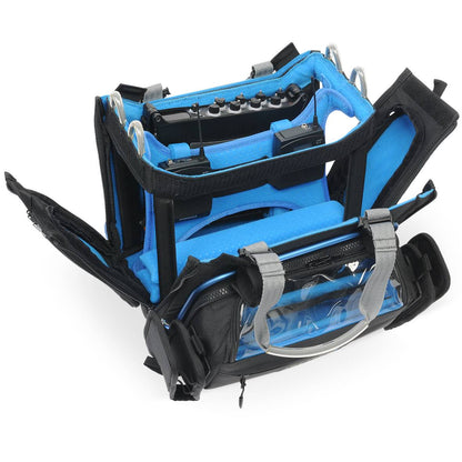 Audio mixer bag with clear front window, blue lining, and zipped side compartments.