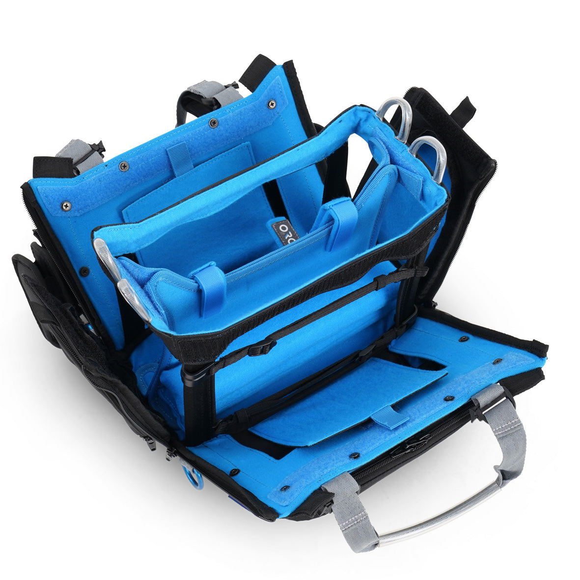 Audio mixer bag with blue interior tray and metal handle loops; side walls show organizer straps