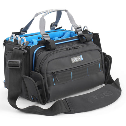 Black audio mixer bag with shoulder strap, blue interior and front zip organizer pockets