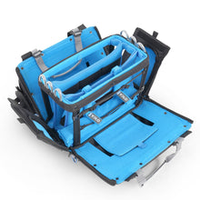 Audio mixer bag open with blue base tray, straps, and black side storage pockets.