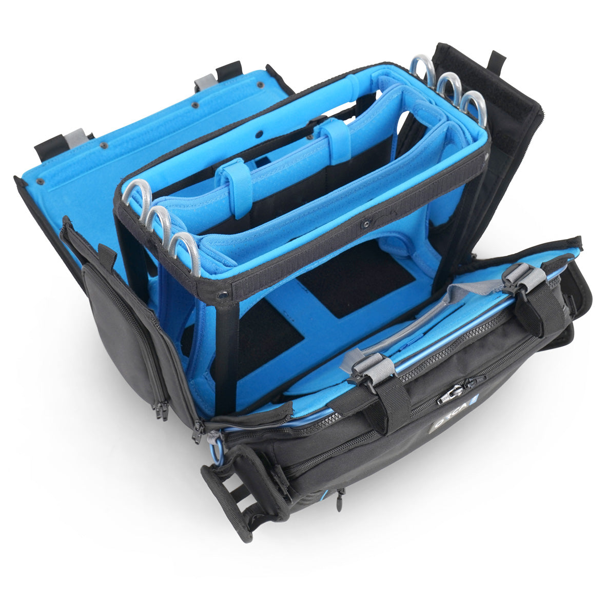 Open audio mixer bag showing blue interior panels, elastic slots, and side compartments.