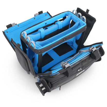 Open audio mixer bag showing blue interior panels, elastic slots, and side compartments.