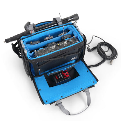 Audio mixer bag open view with blue interior, audio electronics, and coiled cables.