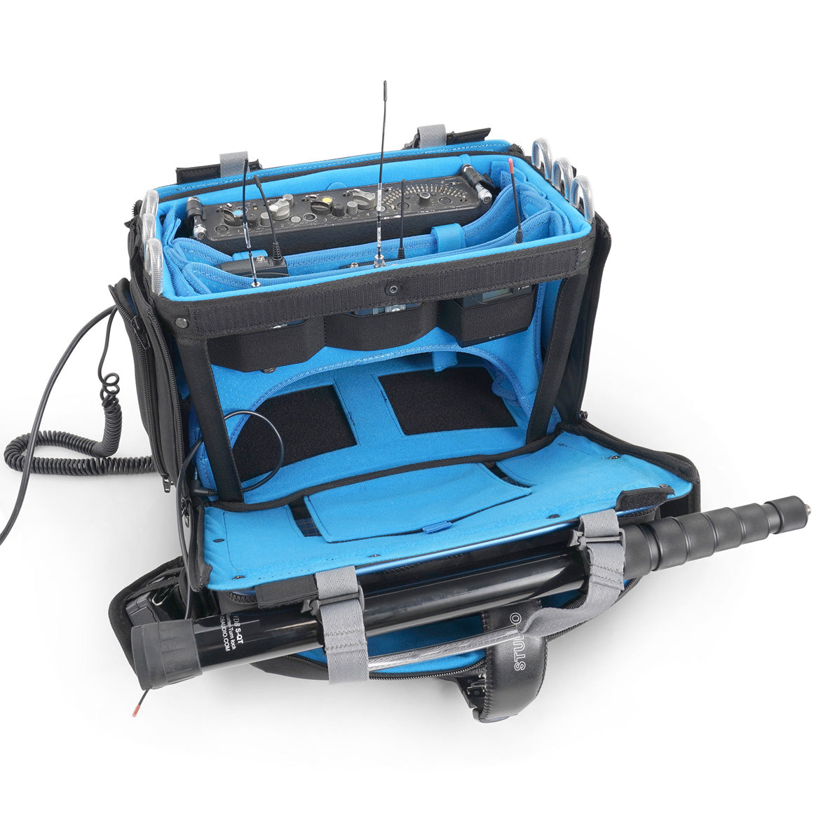 Audio mixer bag open lid with blue interior, mounted components, and cables attached.
