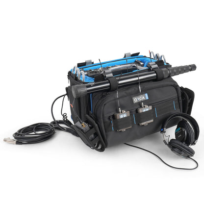 Audio mixer bag open top with blue lining, tool compartments, and bundled cables.