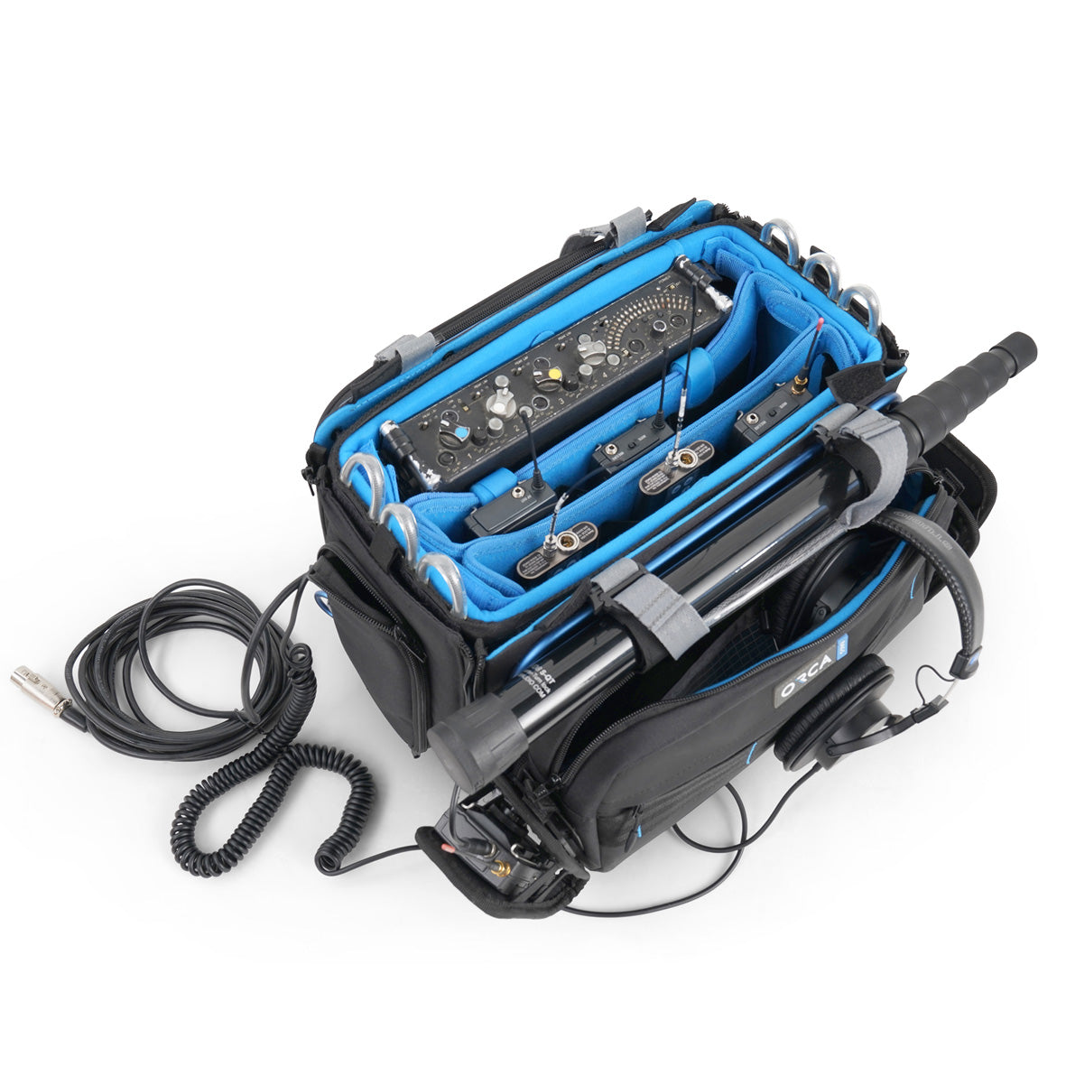 Audio mixer bag loaded with small audio devices and cables inside blue-lined bays.