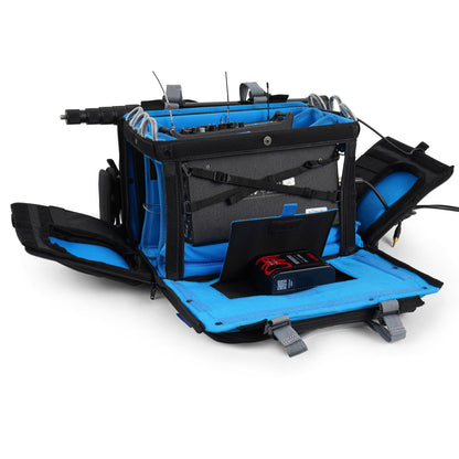 Black and blue audio mixer bag with open internal compartments and organizer panels