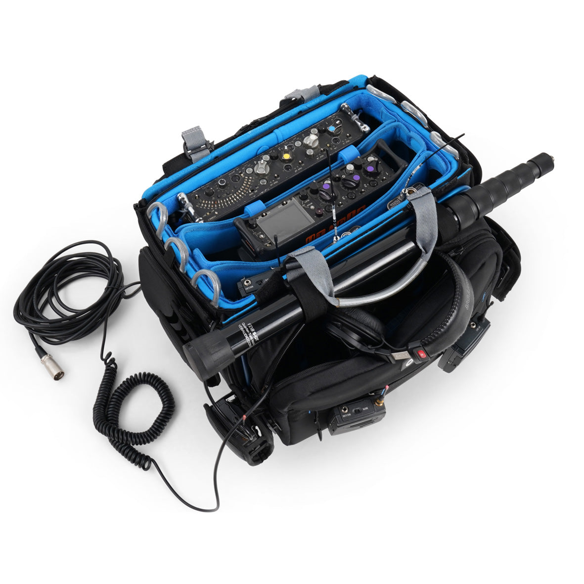 Audio mixer bag with blue-lined compartments holding mixer controls and cables