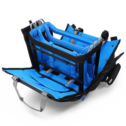 Blue and black audio mixer bag open with foam rails, clips, and shoulder strap