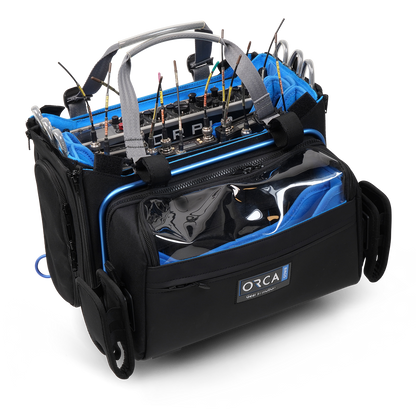 Black and blue audio mixer carry bag with transparent front pocket and ORCA badge