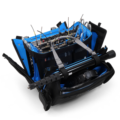 Black and blue audio mixer bag with device trays, foam dividers, and carry handles
