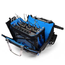 Blue and black audio mixer bag open to show multiple compartments and connectors