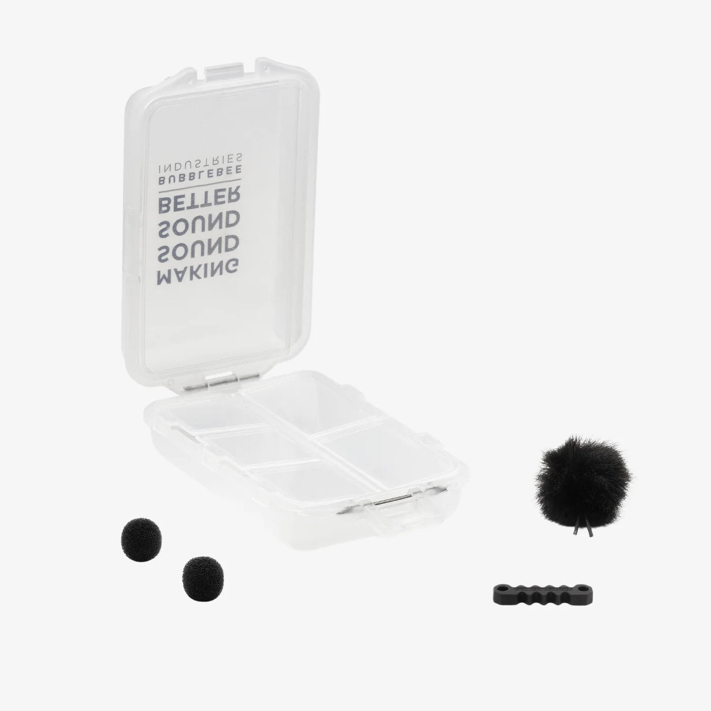 Outdoor mic kit with open case, black foam windscreens, and mounting clips