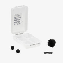 Outdoor mic kit with open case, black foam windscreens, and mounting clips