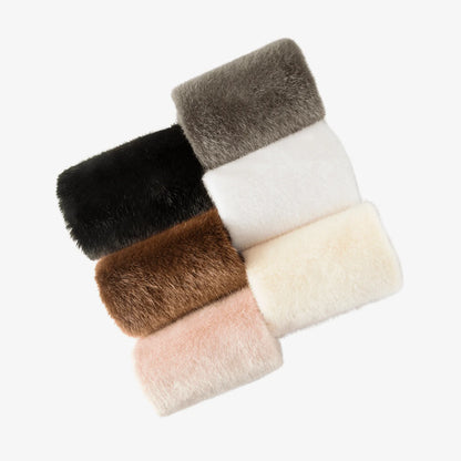 Assorted faux fur patch swatches in black, grey, brown, beige, and off-white
