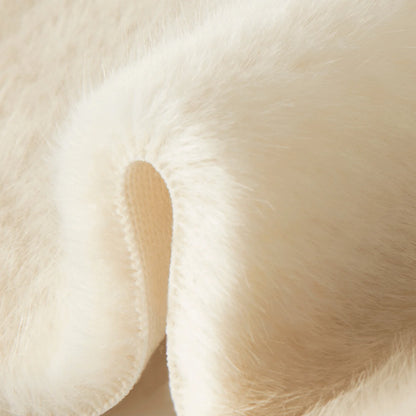 Close-up of off-white faux fur pile texture