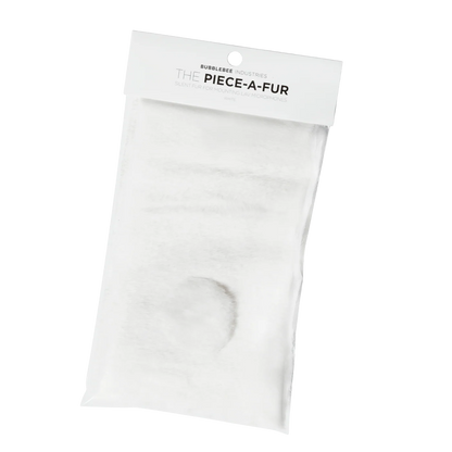 Off-white faux fur patch with adhesive backing and round cutout for mounting
