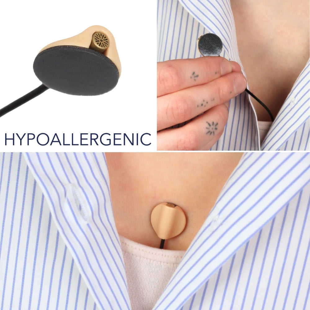 Round sticky pads securing a striped shirt and staying on skin without residue
