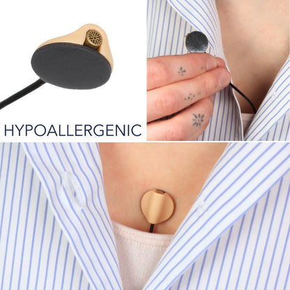 Round sticky pads securing a striped shirt and staying on skin without residue