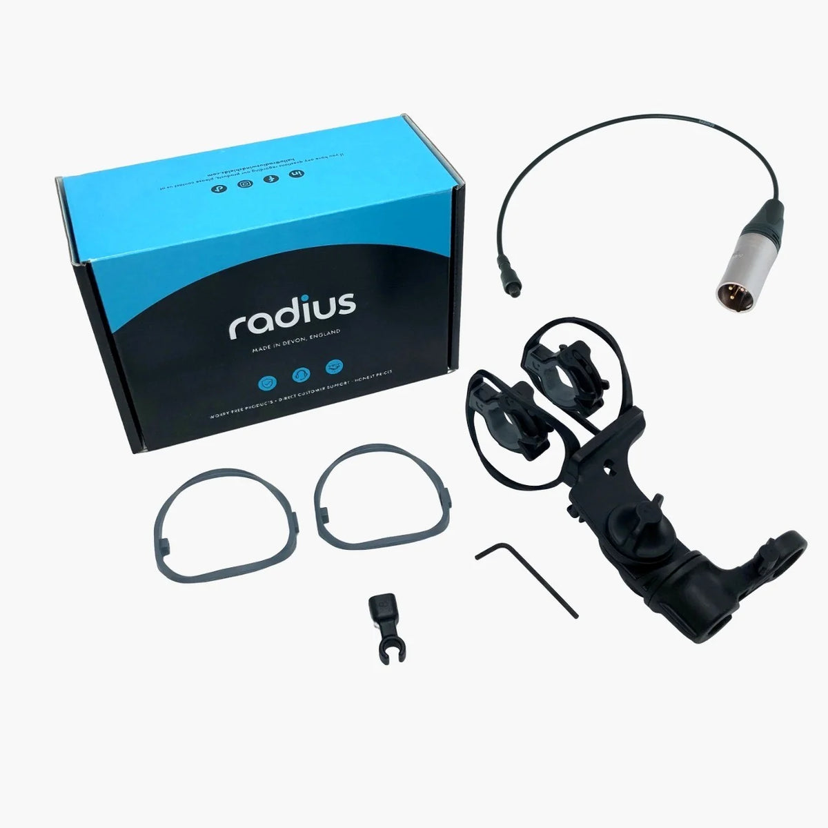 Shock mount kit with black mount, cable leads, small connector, and mounting clips